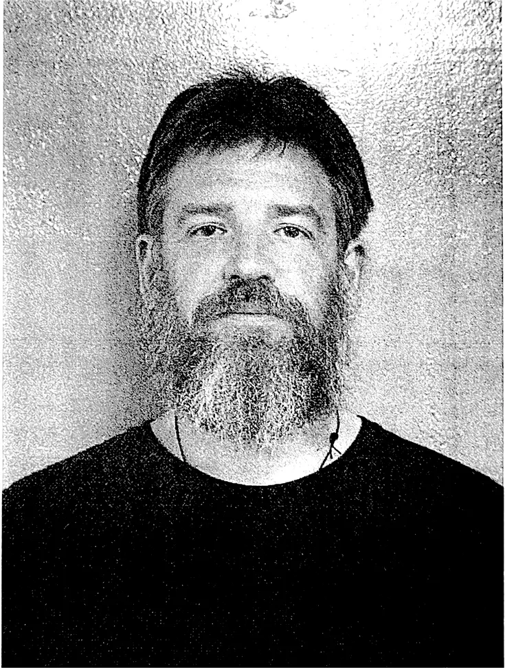 Archpriest Matthew Williams in black and white